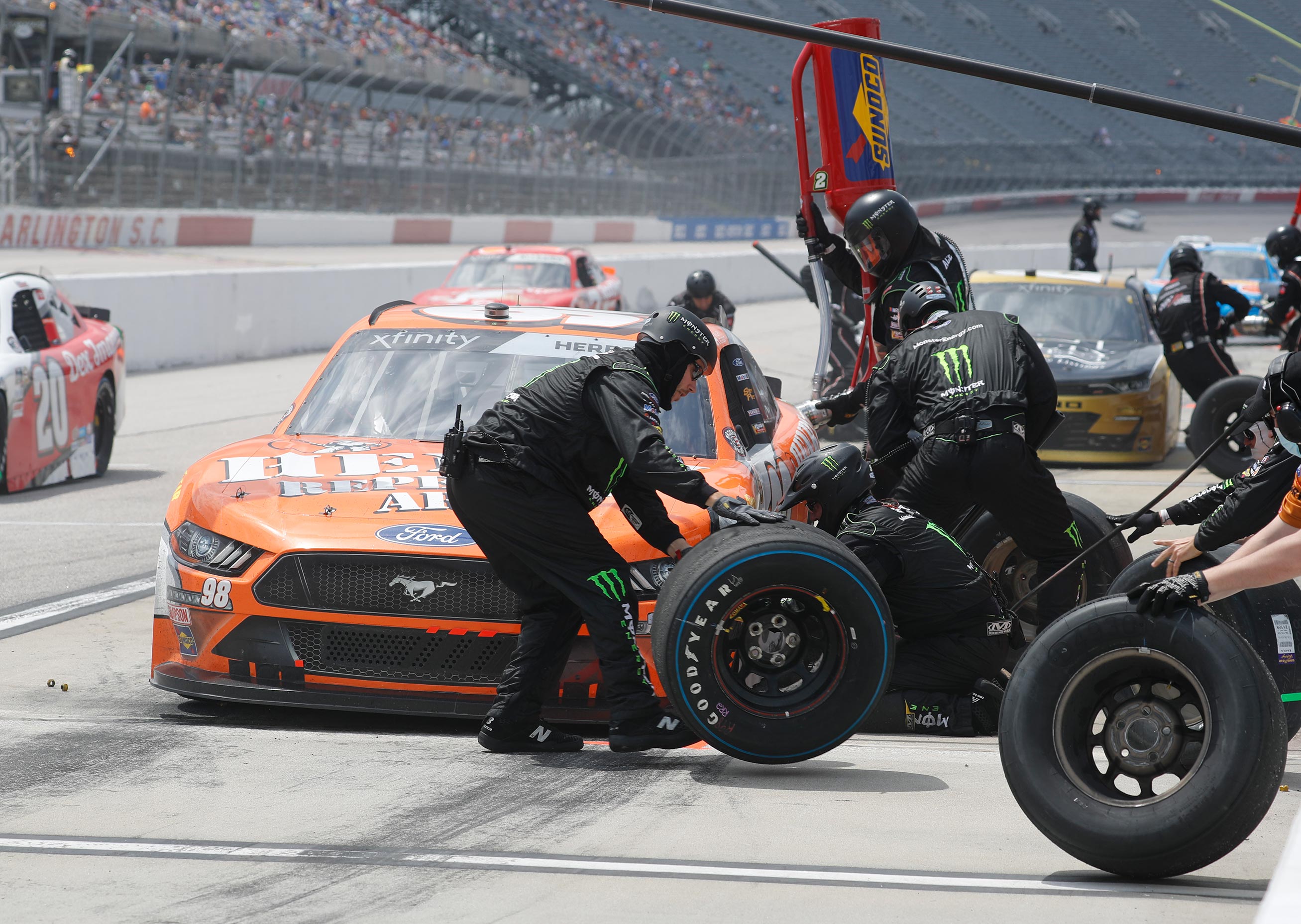 Tires being changed by the Henry pit crew